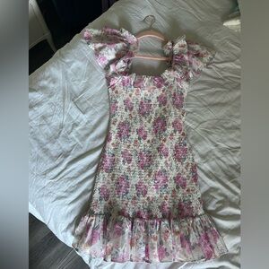 I am selling a floral and slightly tight dress. It is so cute and flattering
